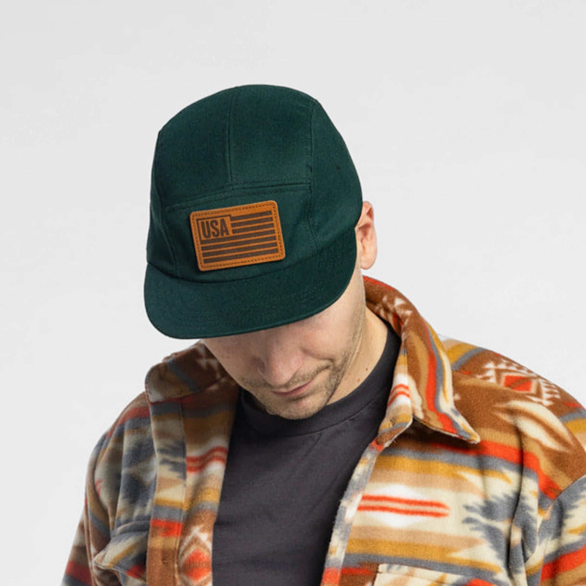 Man wearing Bickford USA Field Patch 5-Panel Wool Cap in green with flannel shirt