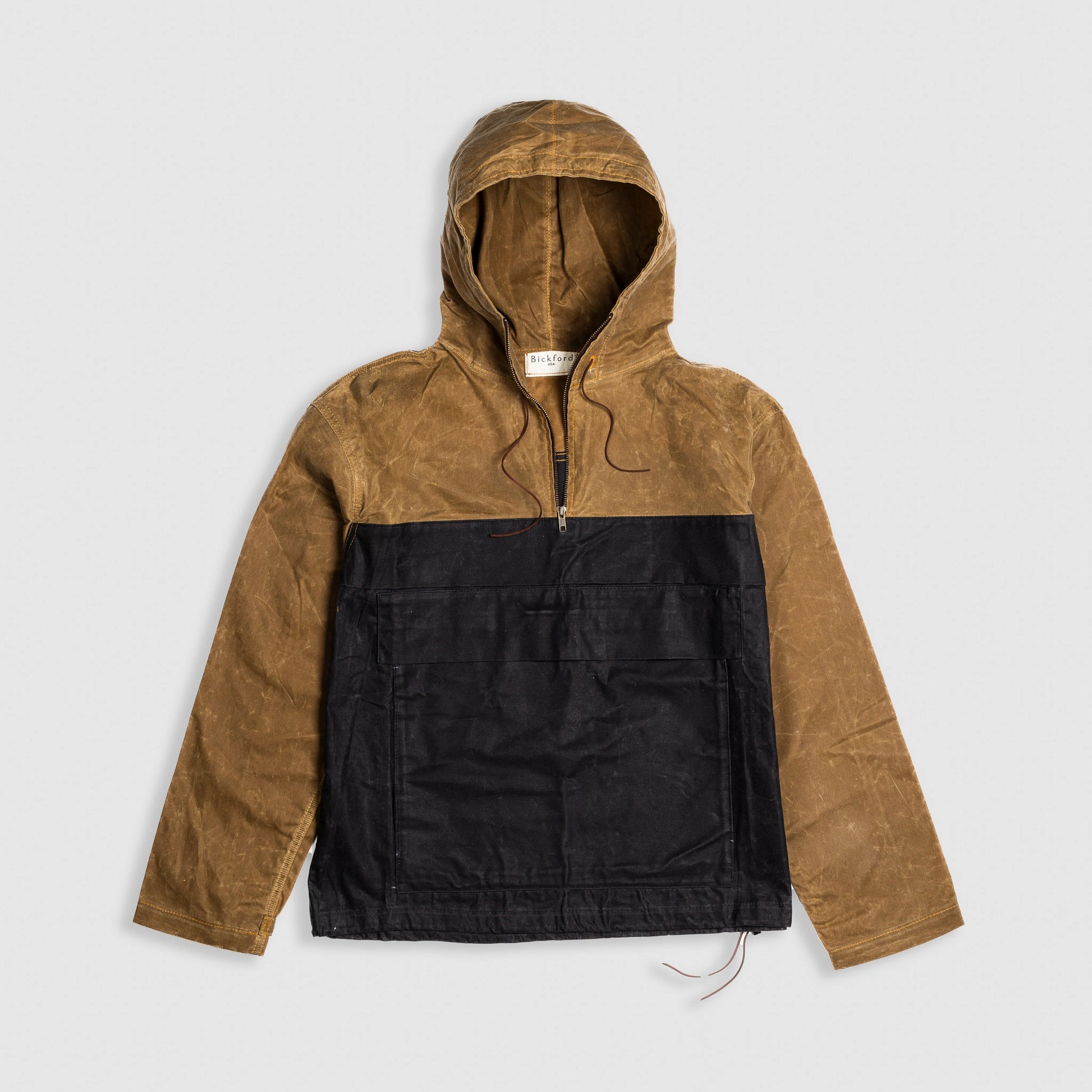 Bickford USA Anorak Sailcloth Jacket in tan and black waxed cotton, flat lay front view with hood up.