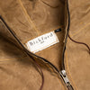 Close-up of the Bickford USA Anorak Sailcloth Jacket collar, showing the woven Bickford USA label, brass YKK zipper, and contrast topstitching on waxed cotton.