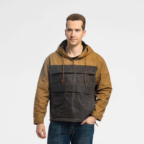 Man wearing the Bickford USA Anorak Sailcloth Jacket in tan and black waxed cotton, front view with hood down.