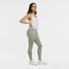 Woman wearing the Bickford USA Athletic Leggings in cloud gray, side view, styled with a white tank and sneakers.