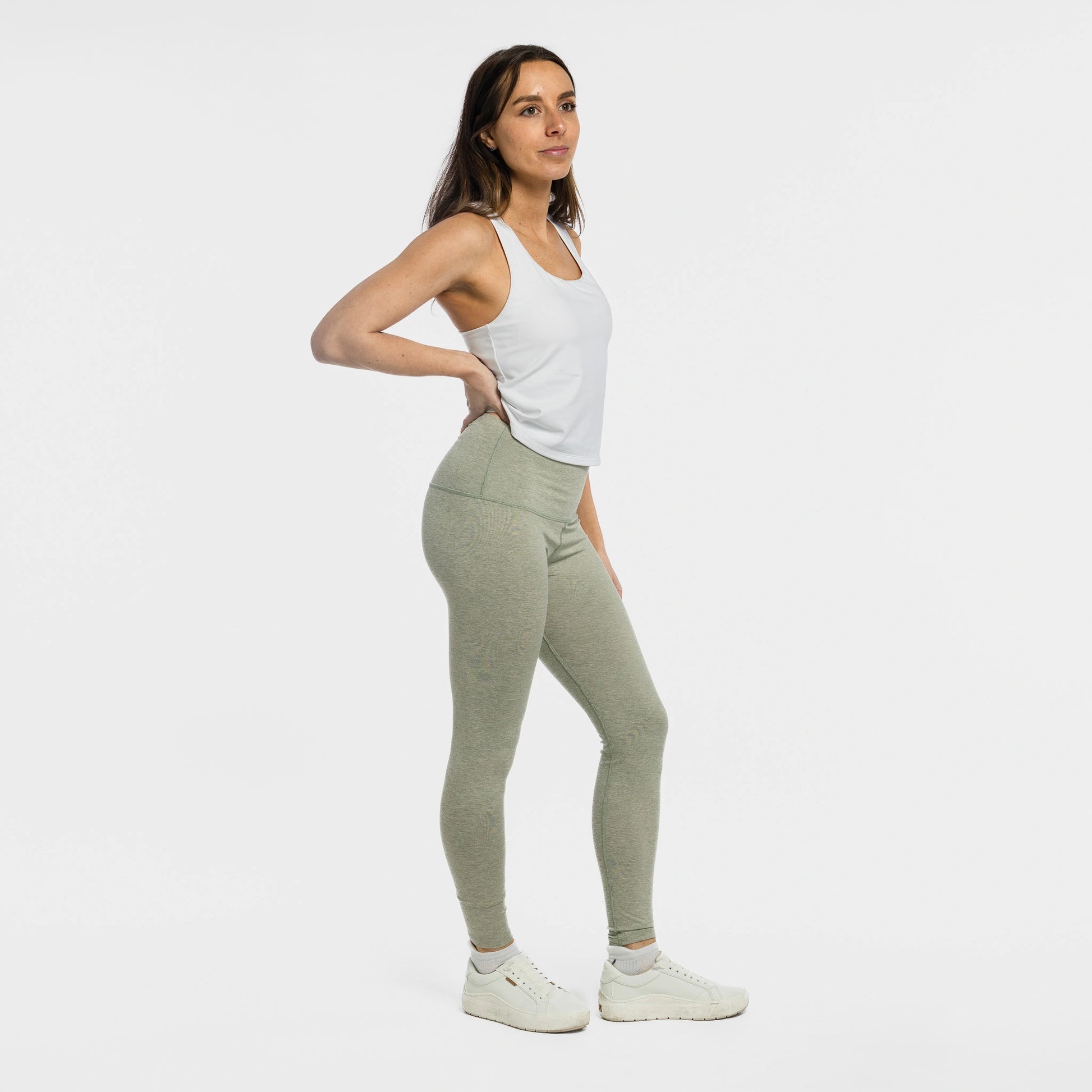 Woman wearing the Bickford USA Athletic Leggings in cloud gray, side view, styled with a white tank and sneakers.