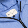 Close-up of Bickford USA woven label and black quarter zipper on Blue Bird hoodie