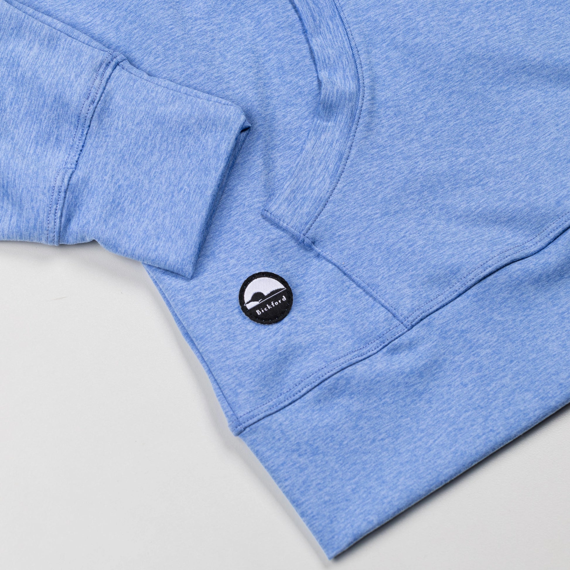 Detail of kangaroo pocket and Bickford logo patch on Blue Bird Athletic Quarter Zip Hoodie