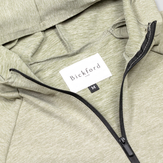 Close-up of Bickford USA woven label and black quarter zipper on Cloud Gray hoodie