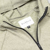 Close-up of Bickford USA woven label and black quarter zipper on Cloud Gray hoodie