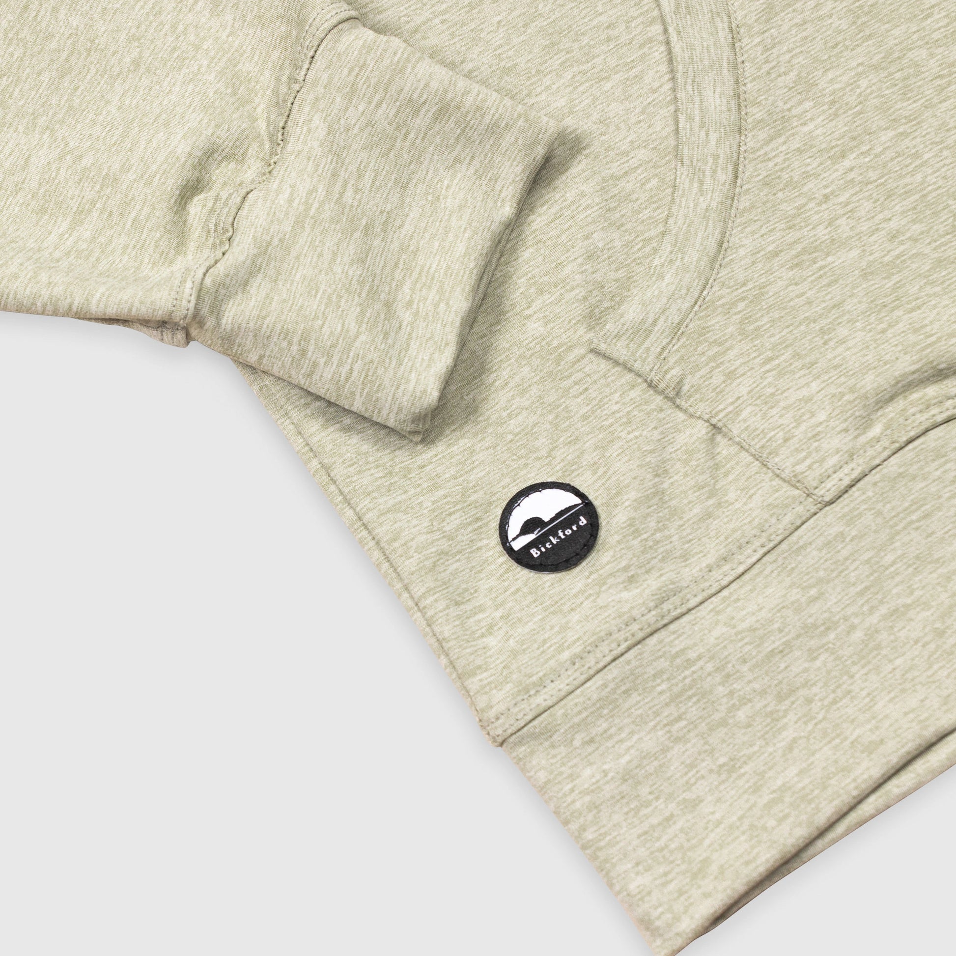 Detail of kangaroo pocket and Bickford logo patch on Cloud Gray Athletic Quarter Zip Hoodie