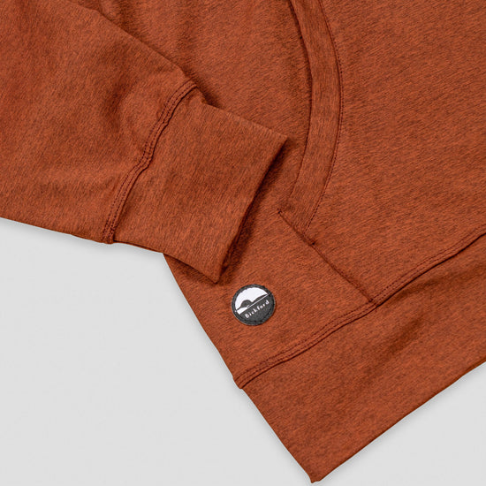 Detail of kangaroo pocket and Bickford logo patch on Rust Athletic Quarter Zip Hoodie