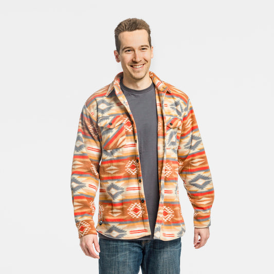 Man wearing the Bickford USA Heritage Trail colorway button-down fleece overshirt open over a gray t-shirt, paired with jeans, smiling and facing forward, against a white background.