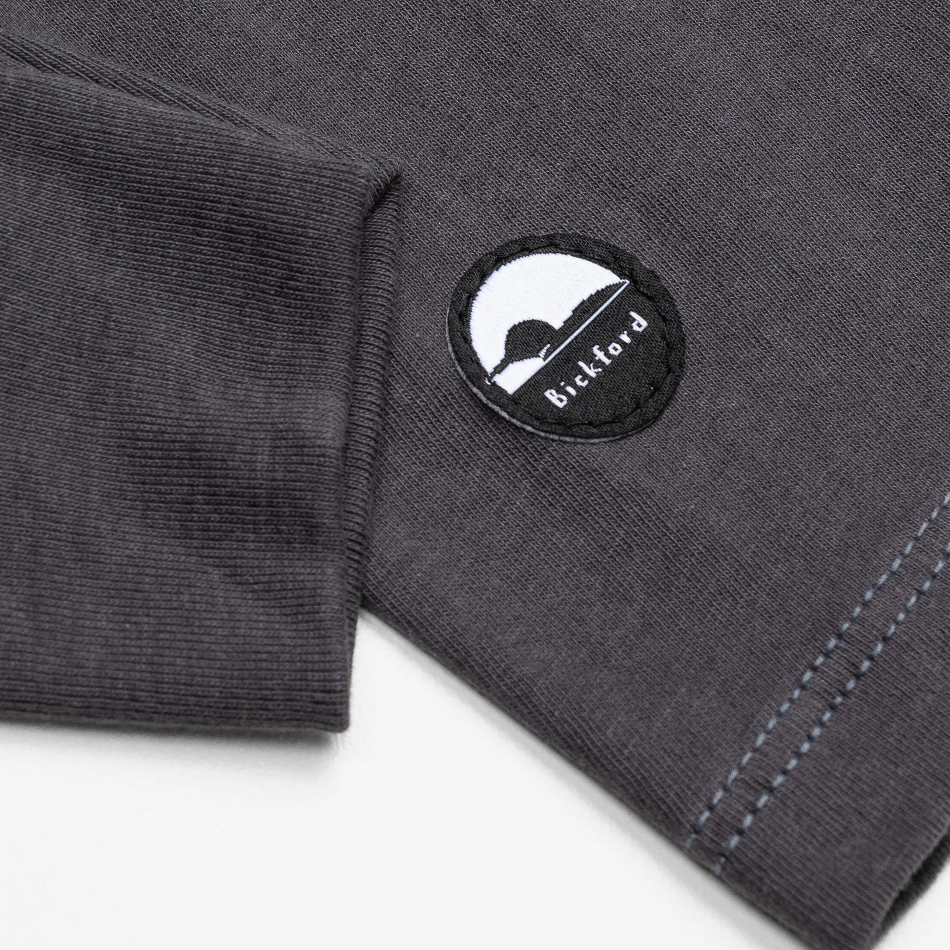 Detail of cuff and Bickford logo patch on Dark Gray Everyday Long Sleeve Tee
