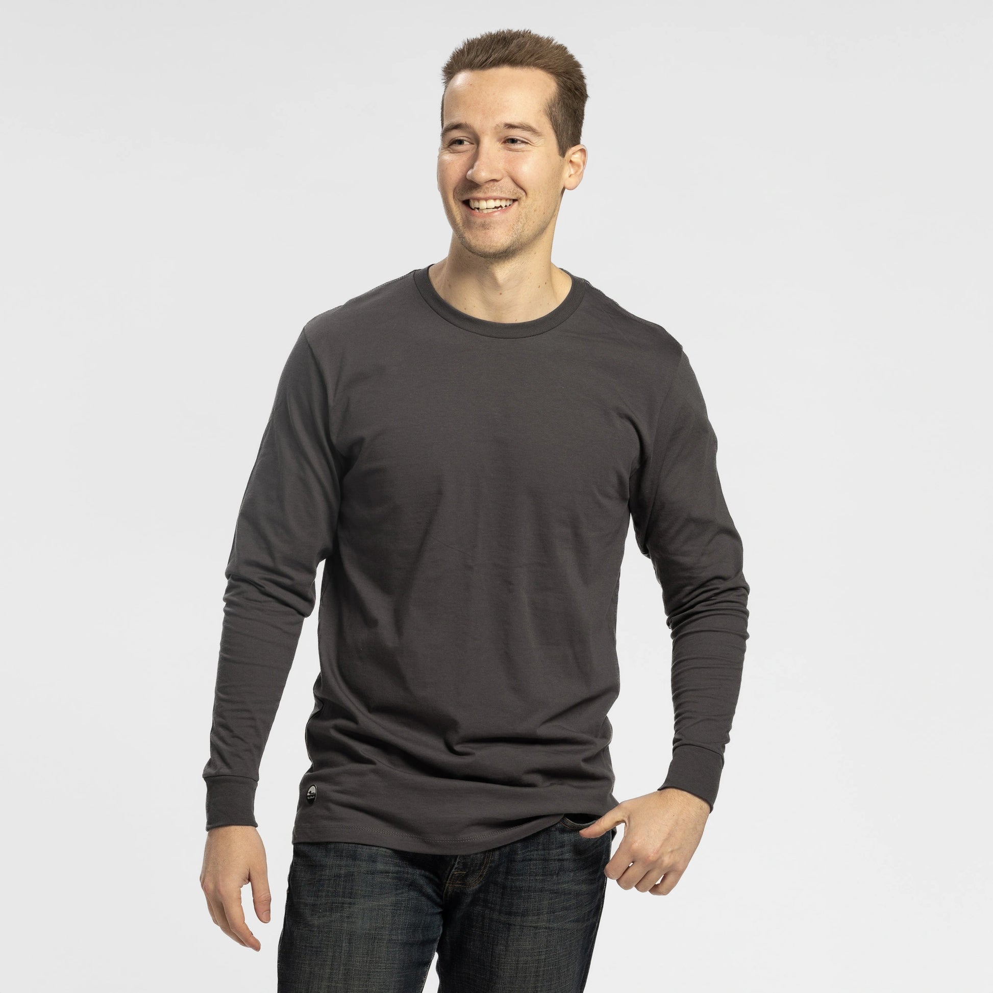 Man wearing Bickford Everyday Long Sleeve Tee in Dark Gray with jeans