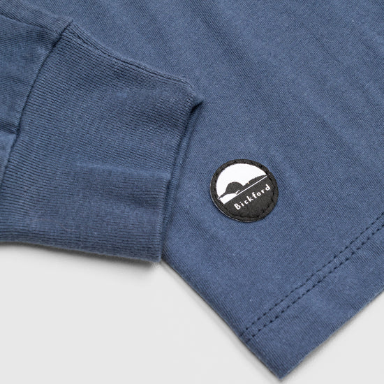 Detail of cuff and Bickford logo patch on Navy Everyday Long Sleeve Tee