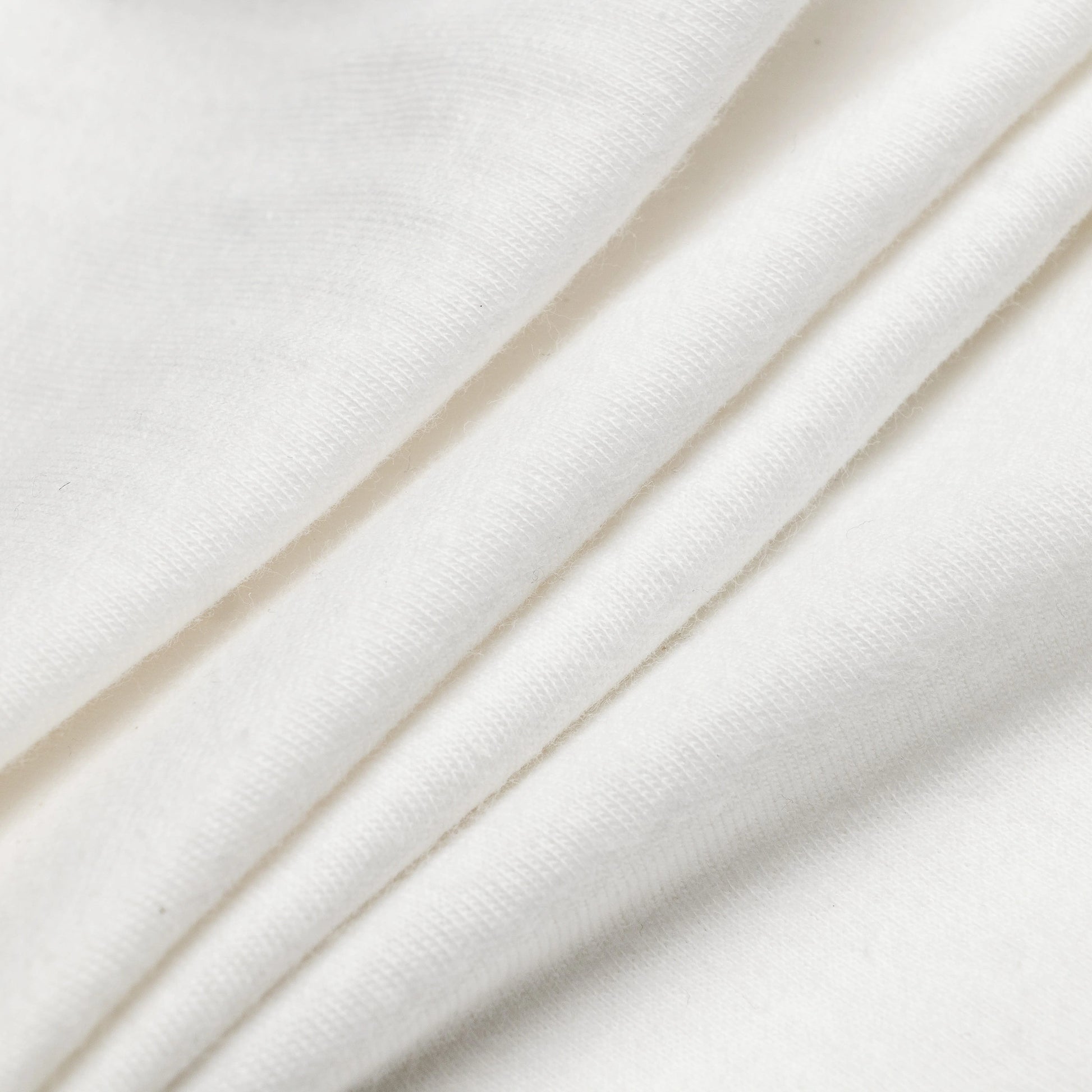 Cotton fabric texture detail of Bickford Everyday Long Sleeve Tee in Natural White