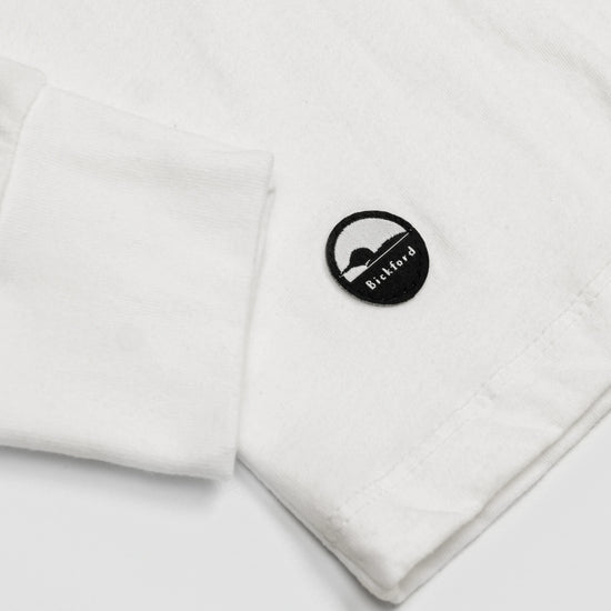 Detail of cuff and Bickford logo patch on White Everyday Long Sleeve Tee