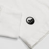 Detail of cuff and Bickford logo patch on White Everyday Long Sleeve Tee