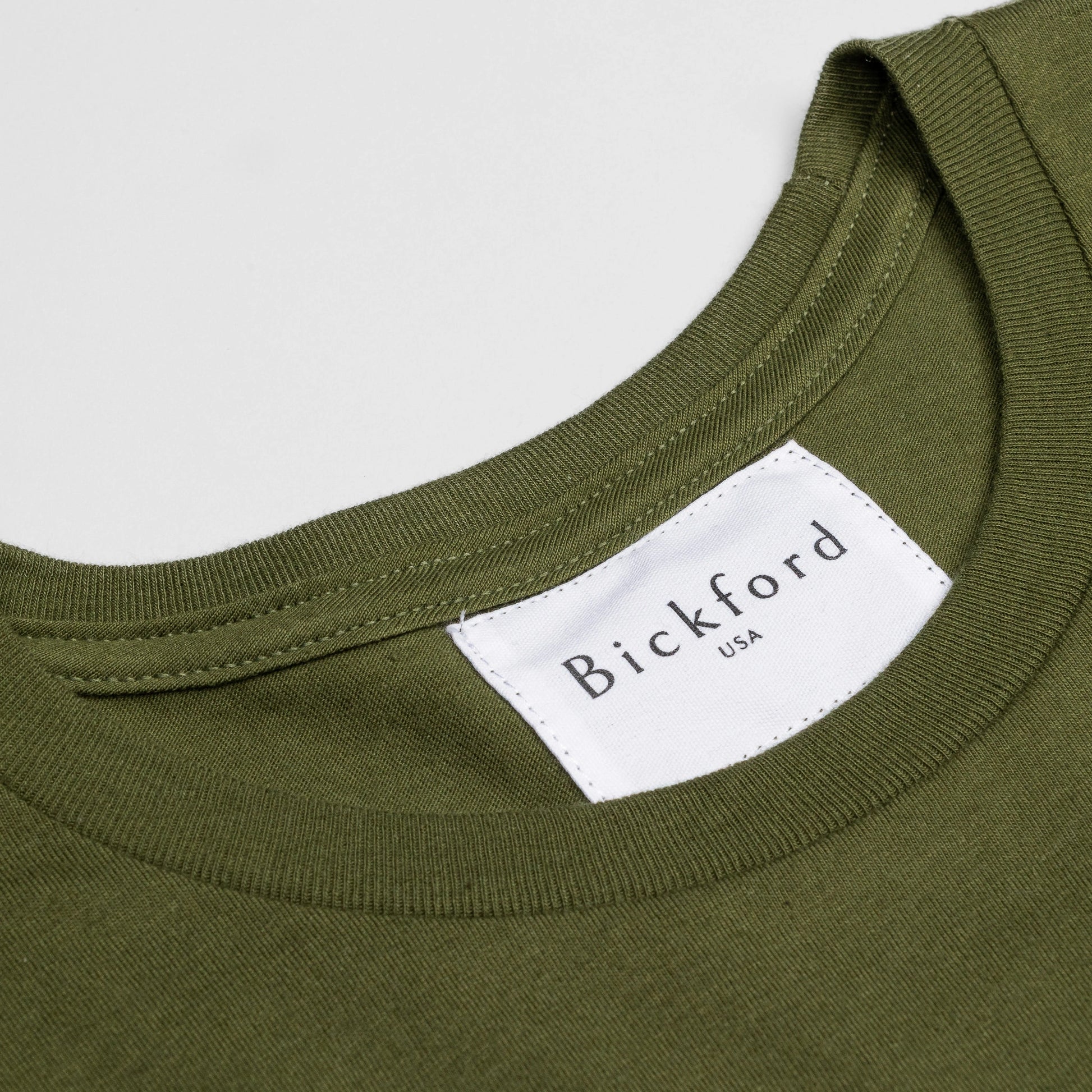 Close-up of Bickford USA woven neck label on Army Green Everyday Tee