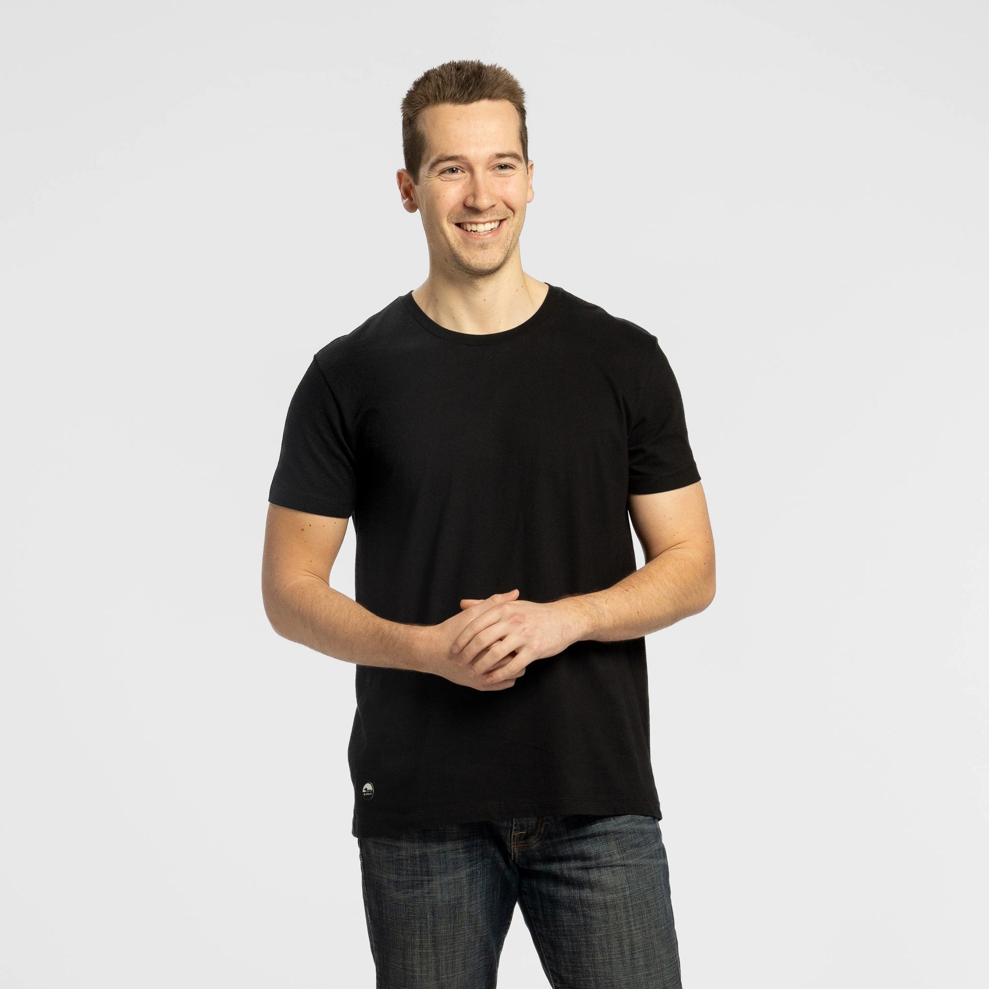 Man wearing Bickford Everyday Tee in Black with jeans