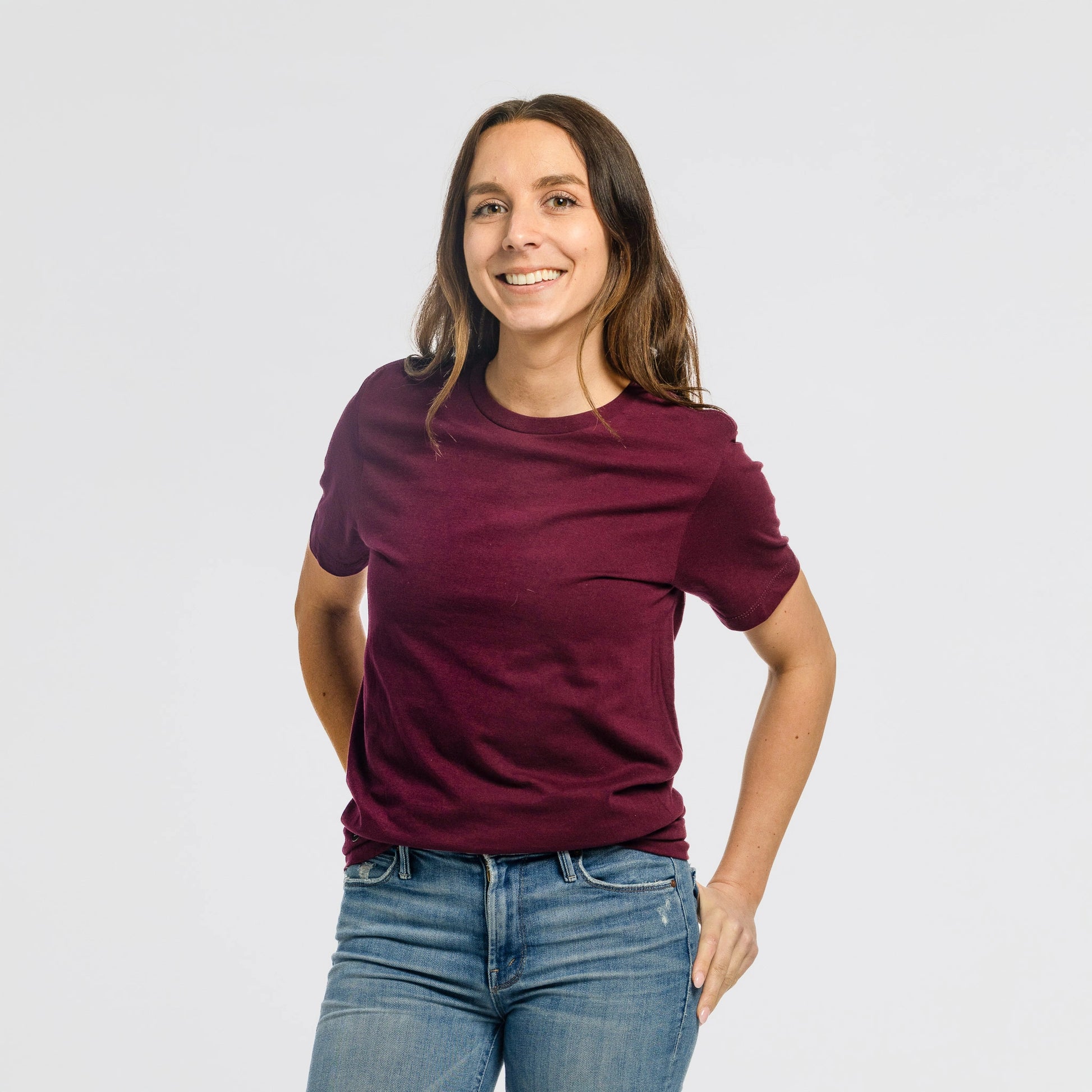 Woman wearing Bickford Everyday Tee in Maroon with jeans