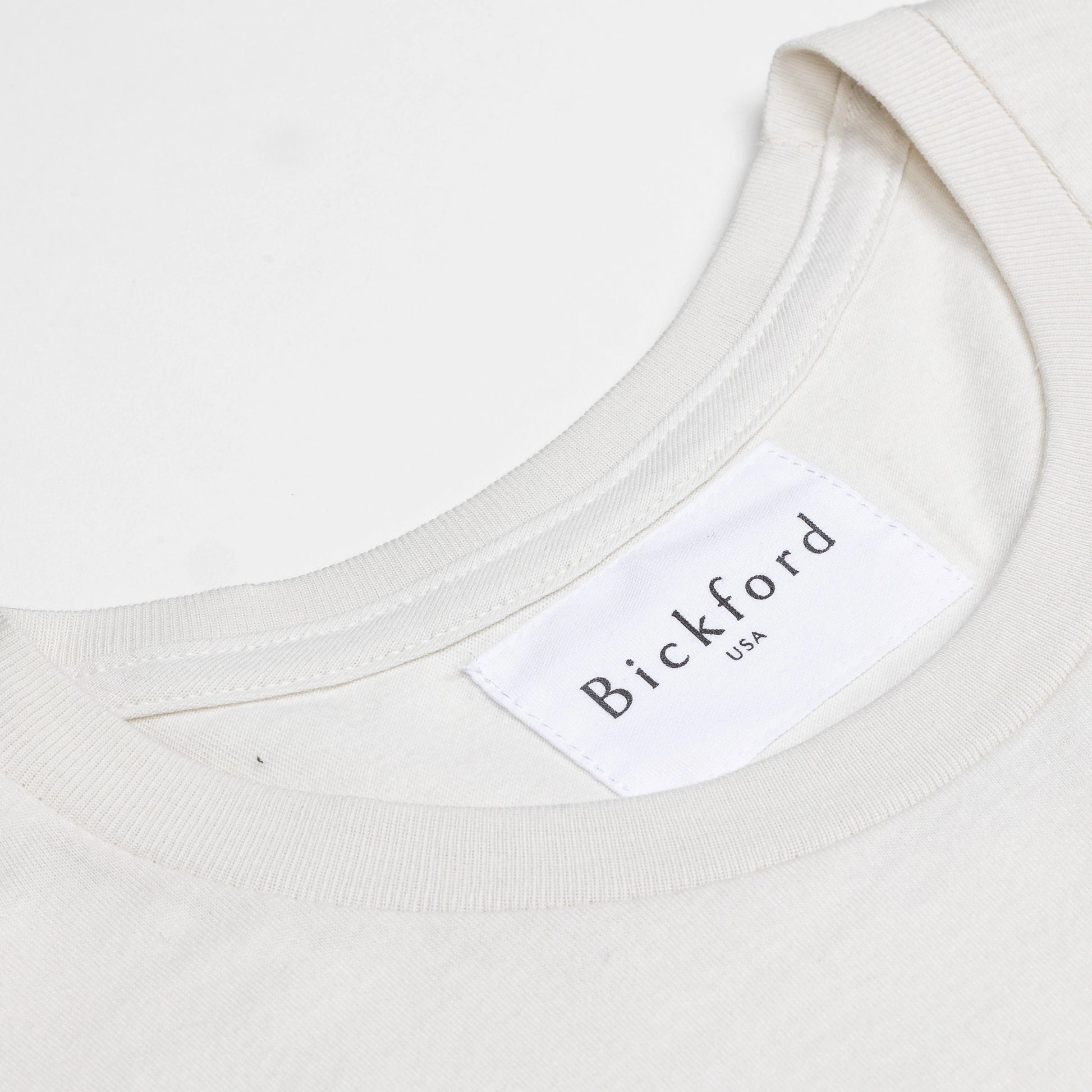 Close-up of Bickford USA woven neck label on Natural White Everyday Tee