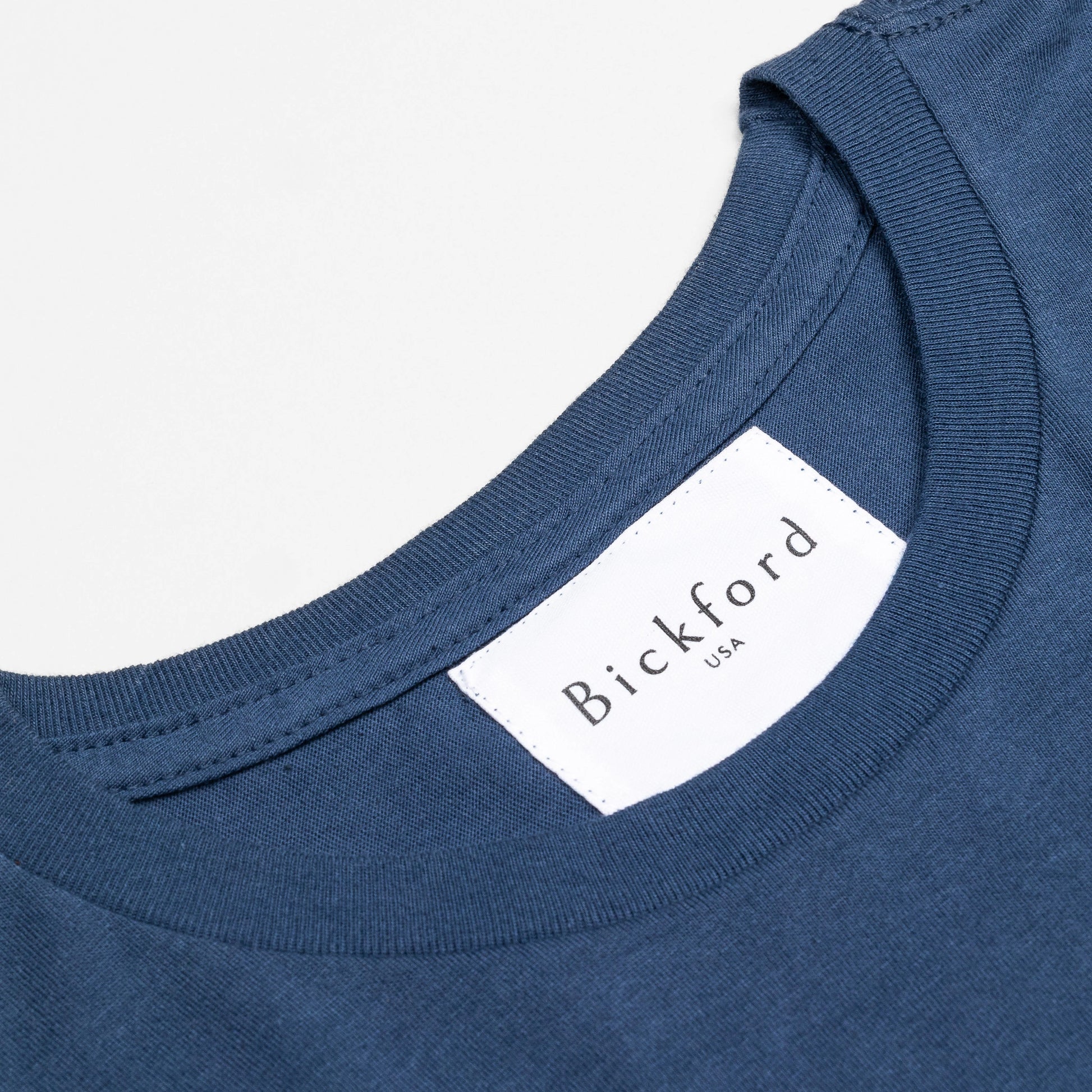 Close-up of Bickford USA woven neck label on Navy Everyday Tee