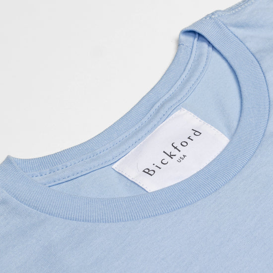 Close-up of Bickford USA woven neck label on Sky Blue Everyday Tee