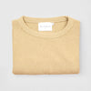 Bickford USA Fisherman Crewneck sweater in cream, neatly folded and photographed from above, with the Bickford USA label visible at the center of the neckline.