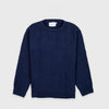 Bickford USA Fisherman sweater in navy, laid flat on a light gray background, showing the full front with seed stitch knit texture and ribbed crew neck, cuffs, and hem.
