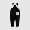 Bickford USA fleece overall bib in black, back view, showing a gray square back pocket and elastic cuffed ankles, against a light gray background.