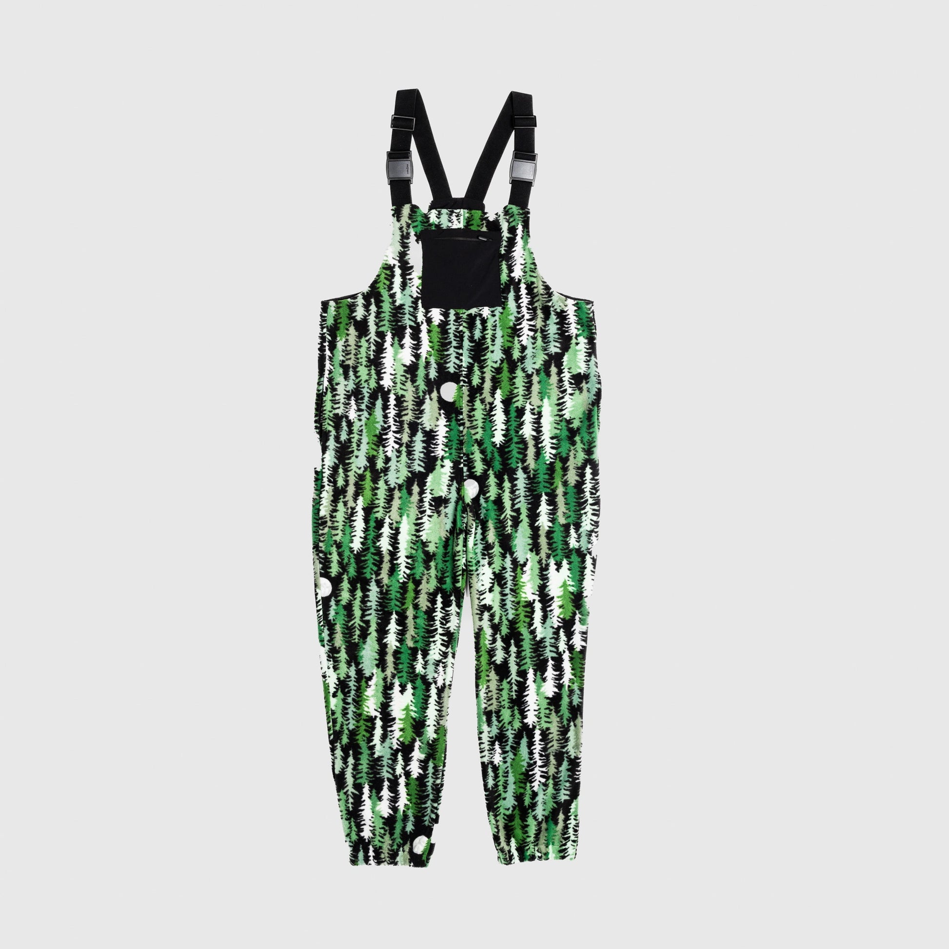 Bickford USA fleece overall bib in the Eastern Pine colorway — a dense forest-and-moon print in deep green, black, and white — front view with black chest pocket and Fidlock buckles, against a light gray background.