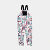 Bickford USA fleece overall bib in the Sugarbush colorway — a white base with an allover winter ski resort print featuring red skis, ski poles, snowboards, evergreen trees, pine cones, ski gloves, and red snowflakes — front view with black chest pocket and Fidlock buckles, against a light gray background.