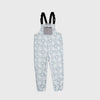 Bickford USA fleece overall bib in the Snowflake colorway — a soft blue-gray base with an allover white floral and snowflake lattice print — front view with gray chest pocket and Fidlock buckles, against a light gray background.