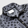 Close-up detail of the open collar and snap placket on the Bickford USA Boulder colorway quarter-snap pullover, showing the black grosgrain trim, silver snap buttons, and Bickford USA size S label inside the collar.
