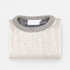 Bickford USA The 1926 Sweater in natural and grey, neatly folded and photographed from above, with the Bickford USA label visible at the center of the contrasting grey ribbed neckline.