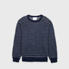 Bickford USA The 1926 Sweater in navy and natural, laid flat on a light gray background, showing the full front with an all-over diagonal birdseye knit pattern in navy and white and a solid navy ribbed crew neck, cuffs, and hem.