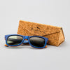 Bickford USA Timberline Full-Frame Sunglasses in deep blue wood beside the branded cork carrying case.