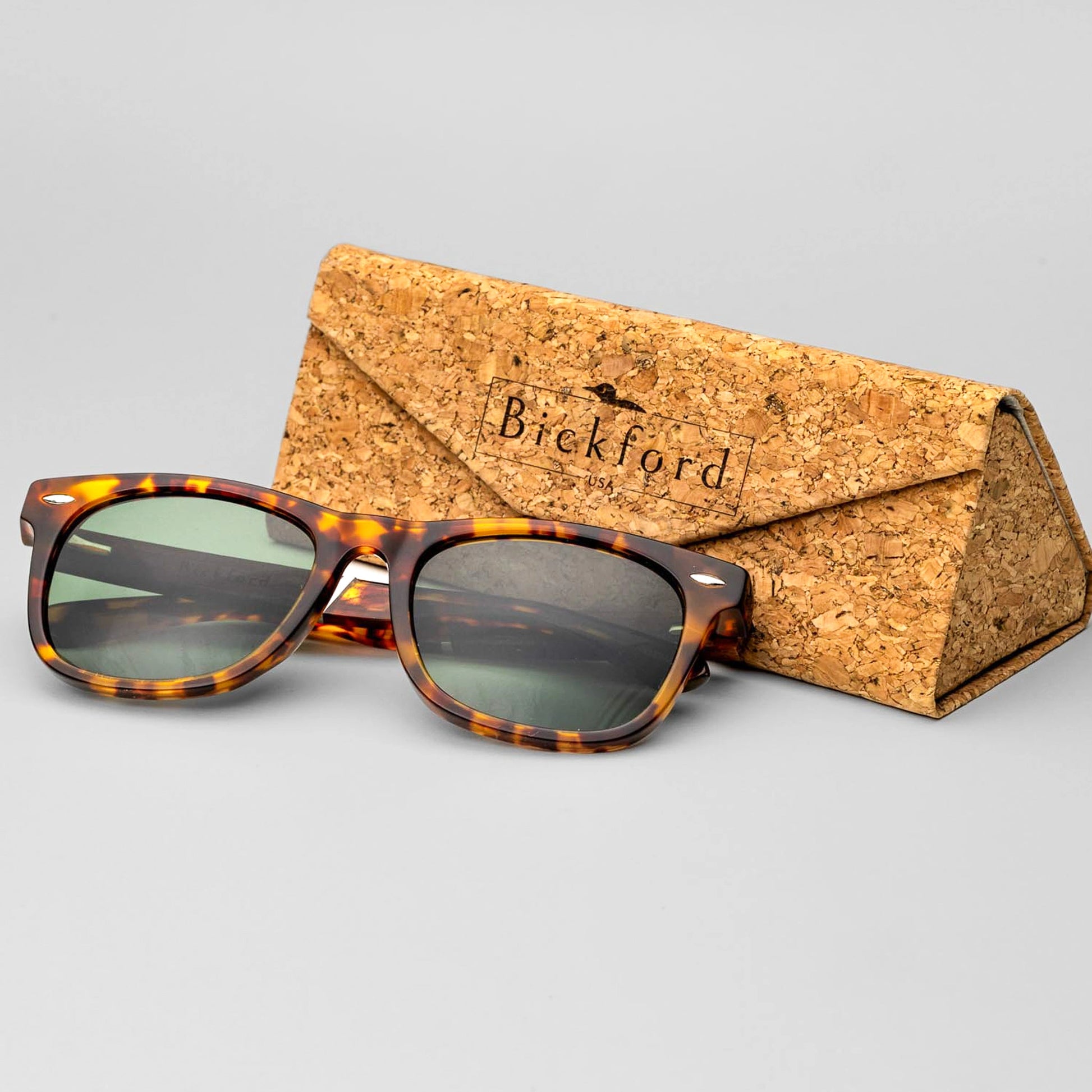 Bickford USA Timberline Full-Frame Sunglasses in tortoise beside the branded cork carrying case.