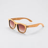 Bickford USA Timberline Full-Frame Sunglasses in natural zebrano wood, angled side view showing the grained wood frame and engraved Bickford logo.