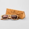 Bickford USA Timberline Full-Frame Sunglasses in natural zebrano wood beside the branded cork carrying case.