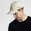 Man wearing Bickford USA Unstructured Chino Cap in Natural with black tee