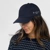 Woman wearing Bickford USA Unstructured Chino Cap in Navy with patterned sweater