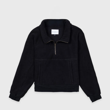 Bickford USA Women's Cropped Quarter-Zip fleece pullover in solid black, laid flat on a light gray background, showing the full front with a wide fold-over collar, brass quarter-zip closure, front kangaroo pocket, and ribbed hem and cuffs.