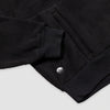 Close-up of the lower hem and kangaroo pocket area of the black Women's Cropped Quarter-Zip, showing the ribbed black hem band, the pocket opening with a knit tab detail, and the small circular Bickford logo patch.