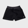 Bickford USA women's fleece shorts in black, flat lay front view, featuring a ribbed elastic waistband, drawstring with barrel-tip ends, side hand pockets, and a circular woven Bickford logo patch on the lower right leg, against a light gray background.