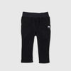 Bickford USA Youth fleece pants in solid black, laid flat on a light gray background, showing the full front with a wide elastic waistband, side hand pockets, and circular Bickford logo patch on the hip.