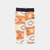 Bickford USA Youth fleece pants in the Heritage Trail colorway, laid flat on a light gray background, featuring an all-over southwestern-style print with diamond and geometric motifs in orange, brown, red, grey, cream, and gold, with a wide black elastic waistband, side hand pockets, and circular Bickford logo patch on the hip.