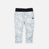 Bickford USA Youth fleece pants in the Snowflake colorway, laid flat on a light gray background, featuring an all-over ornate snowflake and medallion print in grey and white, with a wide black elastic waistband, side hand pockets, and circular Bickford logo patch on the hip.