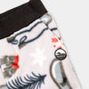 Close-up detail of the Sugarbush Youth Pants showing the wide black elastic waistband, angled side pocket, and circular woven Bickford mountain logo patch against the winter sports-themed print with skis, poles, snowflakes, and pine trees.