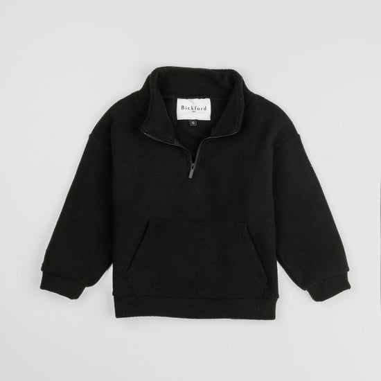 Bickford USA Youth Quarter-Zip fleece pullover in solid black, laid flat on a light gray background, showing the full front with a funnel collar, quarter-zip closure, and front kangaroo pocket.