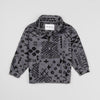 Bickford USA Youth Quarter-Zip fleece pullover in the Boulder colorway, laid flat on a light gray background, featuring an all-over black geometric tribal print on a grey background, with a funnel collar, quarter-zip closure, and front kangaroo pocket.