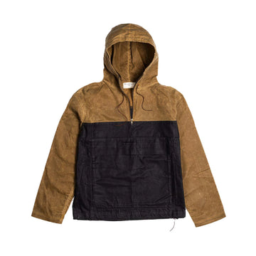 Bickford USA Anorak 2.0 in two-tone tan and black waxed canvas, flat lay front view, featuring a drawstring hood, half-zip chest opening with leather pull cords, large black kangaroo pocket across the front, and a drawcord hem, against a white background.